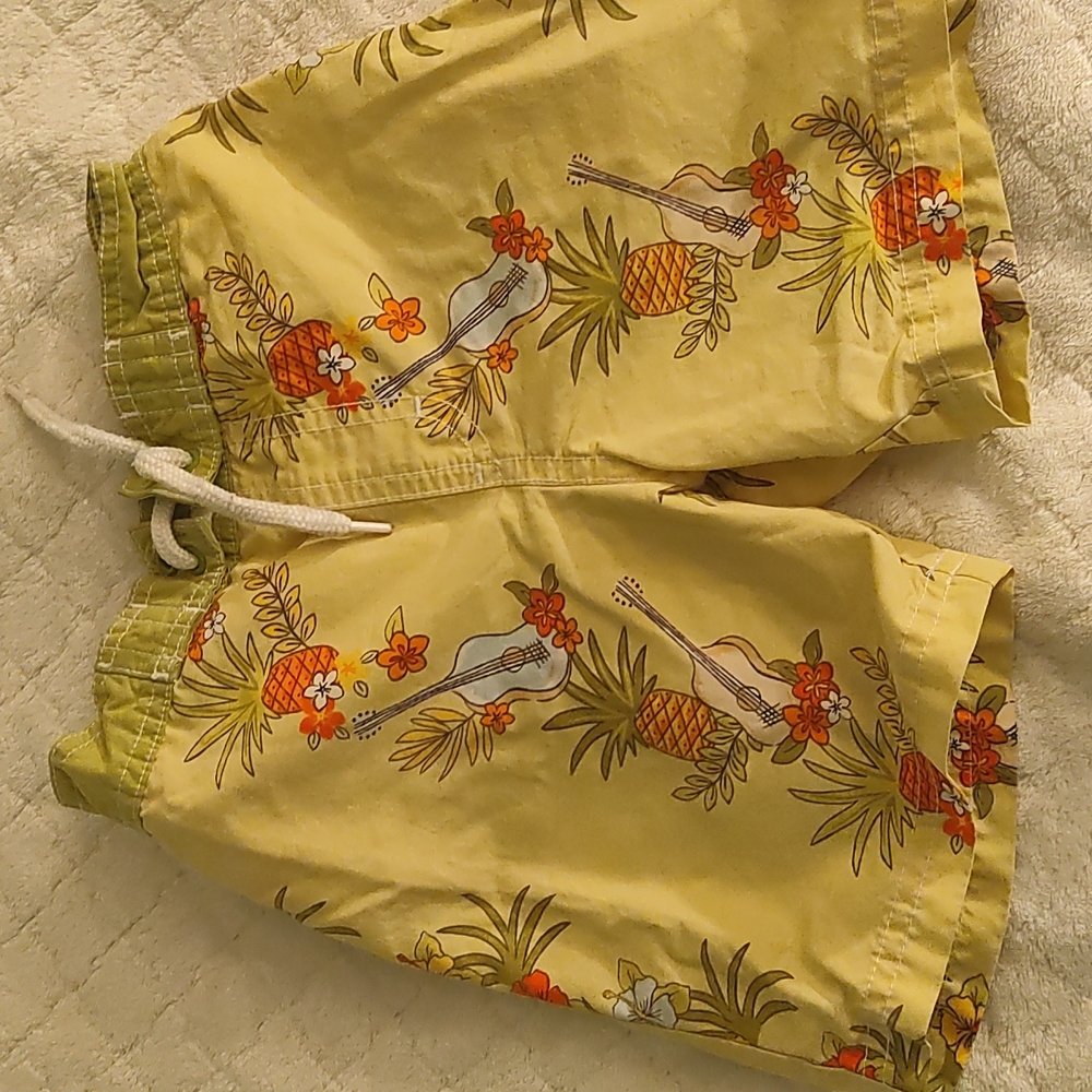 Gymboree yellow flowered swim short for little boys.